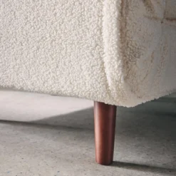 sweeek Poltrona letto bouclé con base in legno