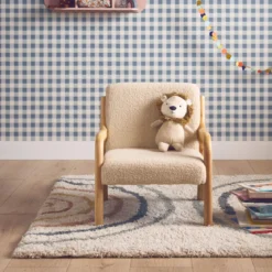 Poltrona scandinava per bambini in tessuto bouclé e legno