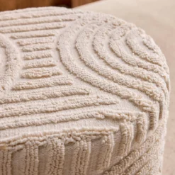 Pouf rotondo in bouclé testurizzato