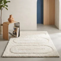 Tappeto da interno con motivi geometrici crema