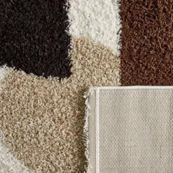 sweeek Tappeto interno shaggy motivi circolari beige, marrone, nero