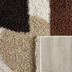 Tappeto interno shaggy motivi circolari beige, marrone, nero